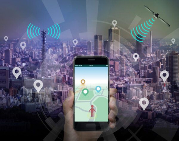 smart city and smart phone application using location information, hand hold smart phone communicating with satellite and wireless communication antenna, abstract image visual